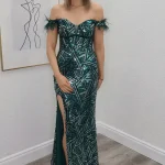 paige green sequin evening gown with feather sleeve