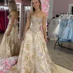 kyra white and gold gown